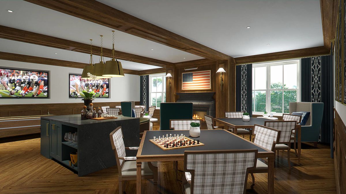 A cozy dining and game room featuring a fireplace, chess set on the table, and checkered chairs.