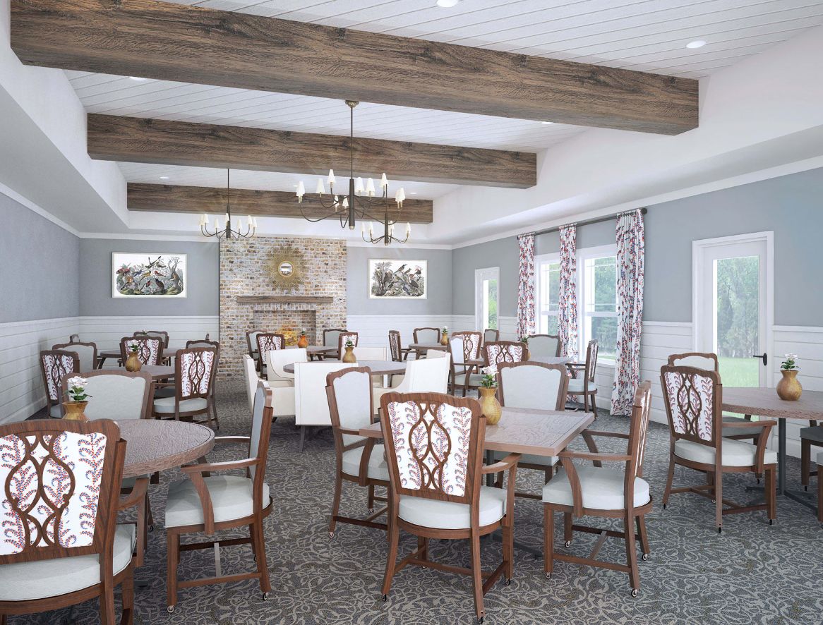 A spacious and elegantly decorated dining room with wooden beams, chandeliers, and a fireplace.