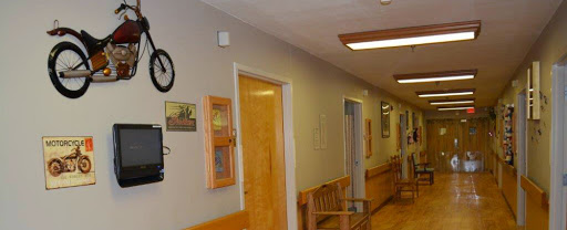 A serene hallway featuring wooden benches and decorative elements.