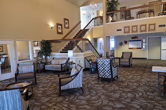 A spacious lobby area with comfortable seating and elegant interior design.