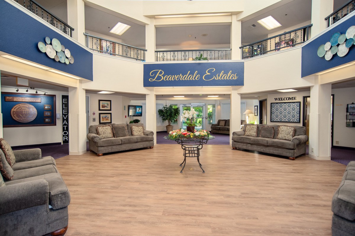 A spacious and welcoming lobby area with sofas and decorative elements.