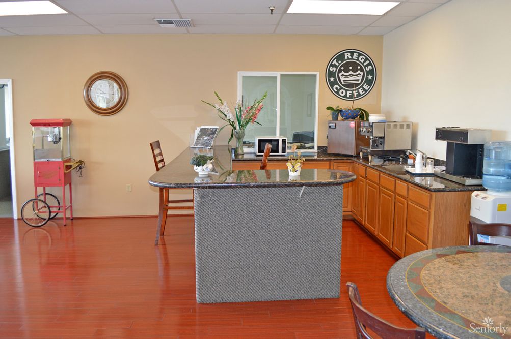 A welcoming office reception area with a counter and coffee machine.
