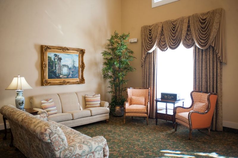 A cozy living room with elegant furniture and decor.