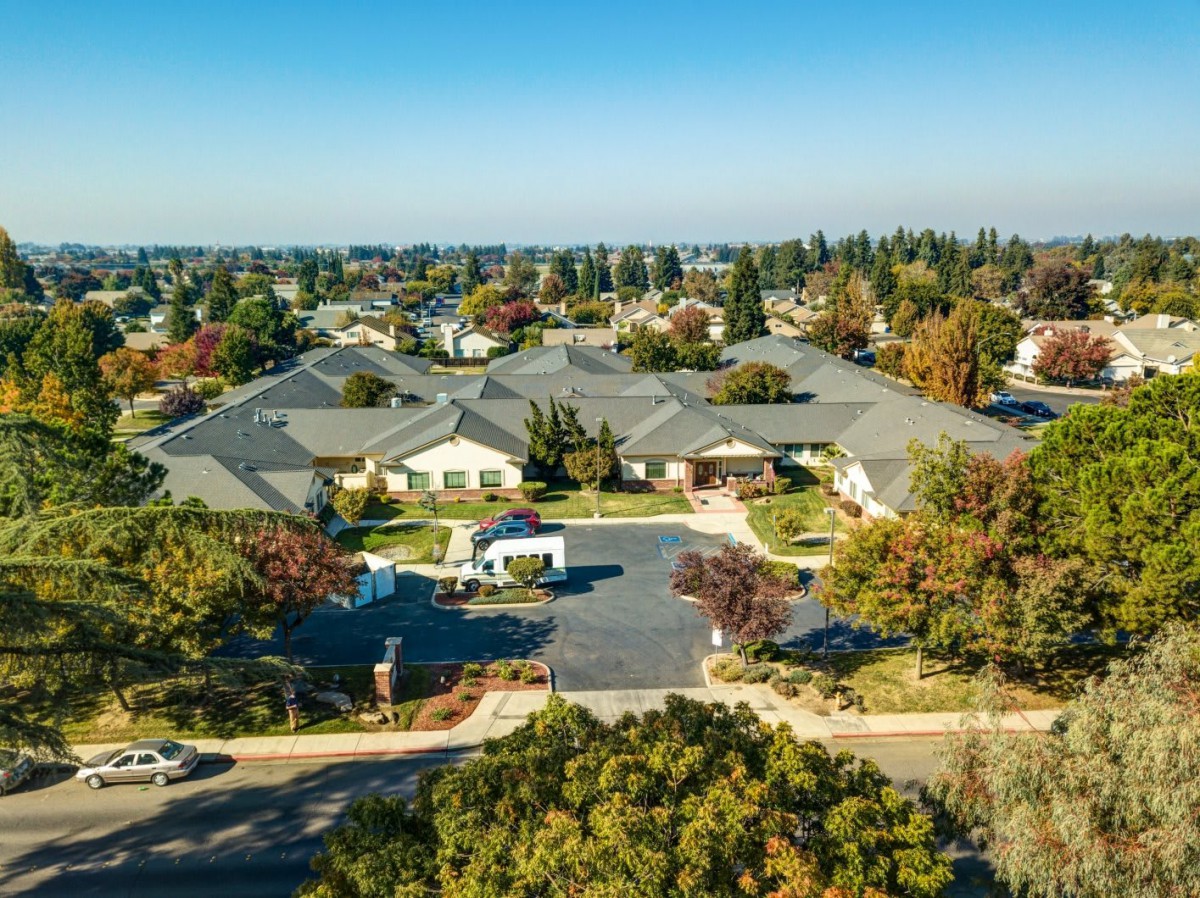 Aerial view of a suburban neighborhood with houses and trees.