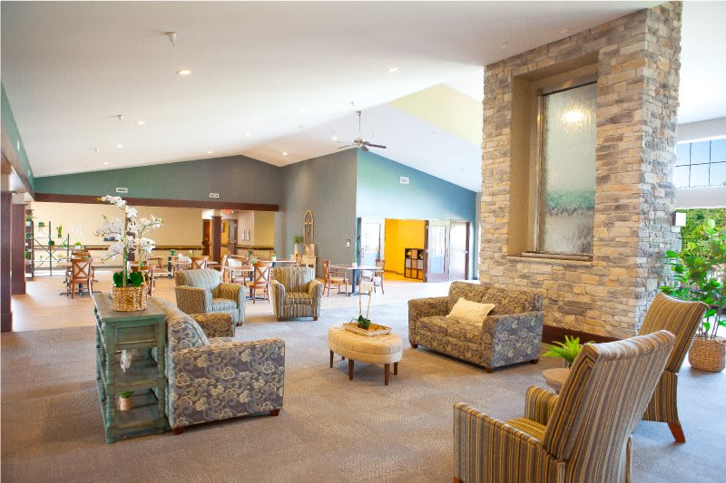 A spacious and cozy living room with modern design elements and comfortable seating.