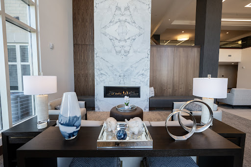 A beautifully designed modern living room featuring a stylish fireplace and elegant decor.