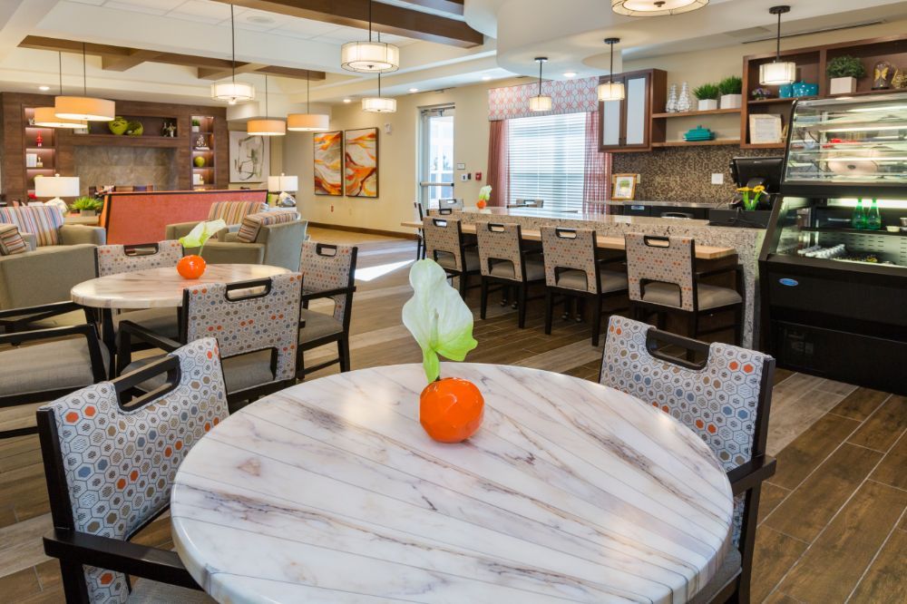 A modern dining area with stylish decor and lighting.