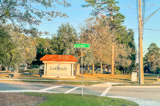 Entrance to a community named 'Lakeside' with a street sign visible.