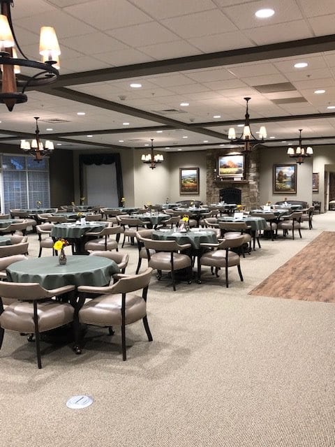 Spacious dining area with neatly arranged tables and chairs.