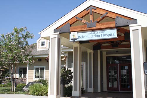 The entrance of a rehabilitation hospital, showcasing a welcoming design.
