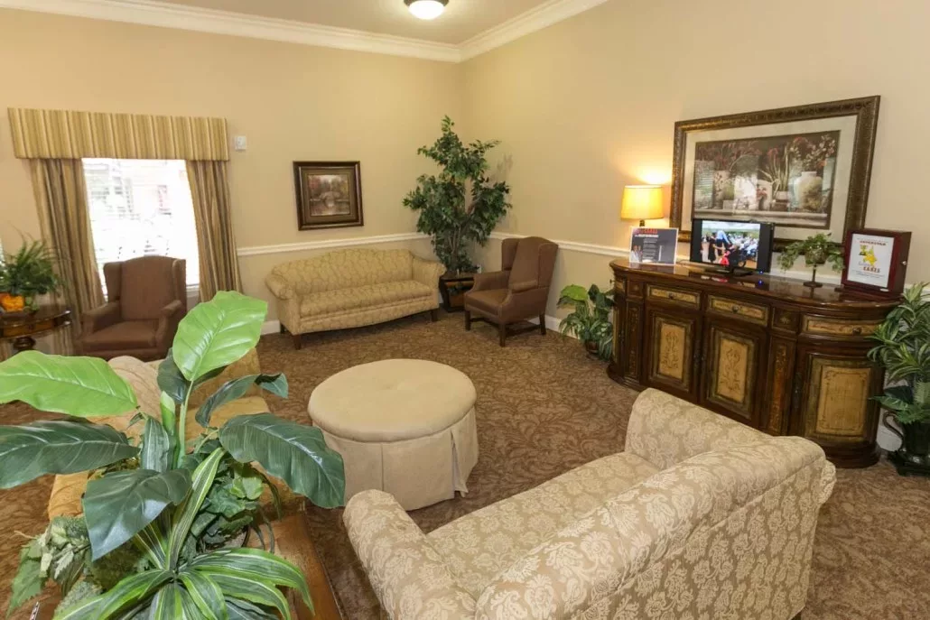 A cozy living room with sofas, armchairs, and decorative elements.
