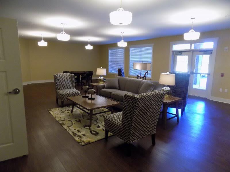 A cozy living room with comfortable seating and soft lighting.