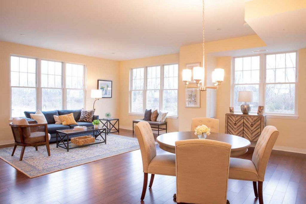 A spacious living and dining area with elegant furniture and ample natural light.