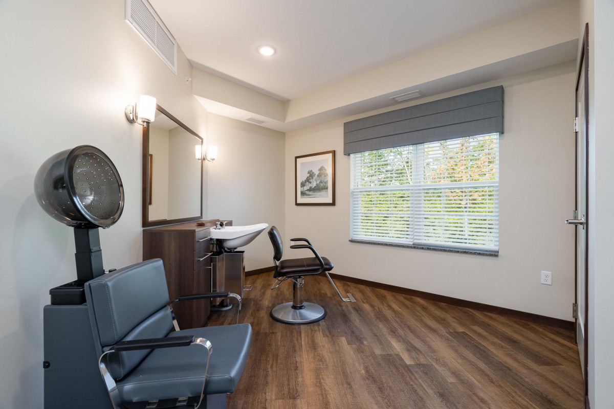 A modern salon interior with stylish furnishings and bright lighting.