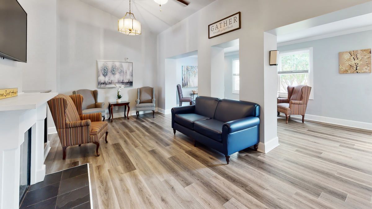 A cozy living room with stylish furniture and hardwood flooring.