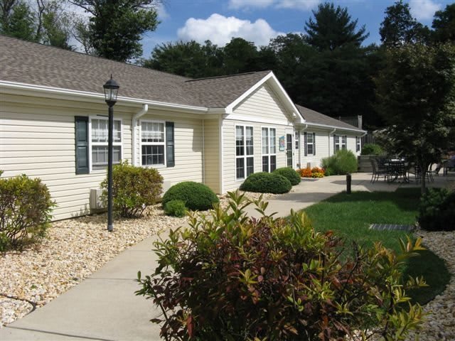 A suburban house with a well-maintained garden and pathway.