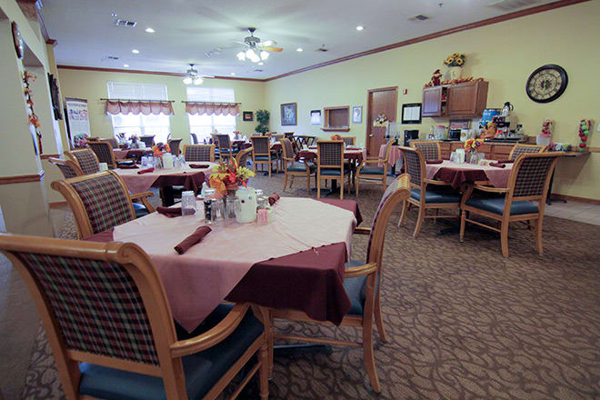 A well-arranged dining area with neatly set tables and comfortable chairs.