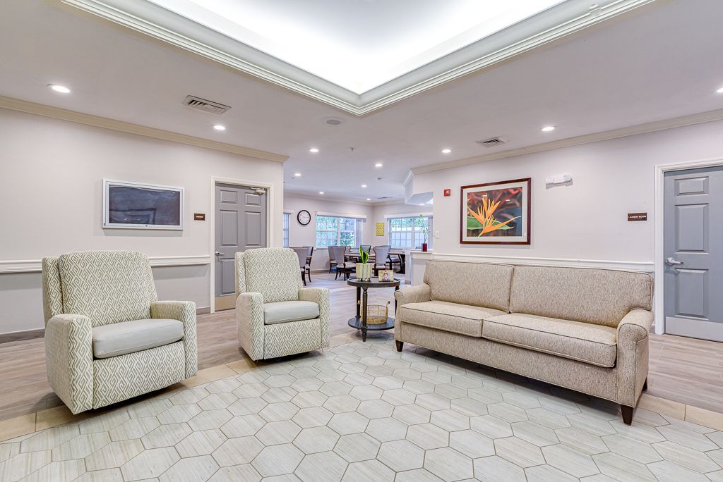 A modern living room with comfortable seating and elegant decor.