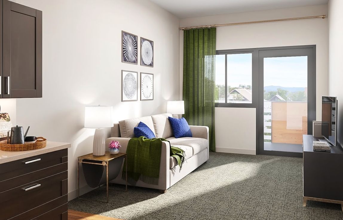A modern living room with a cozy sofa, decorative pillows, and vibrant green curtains allowing natural light to pour in.
