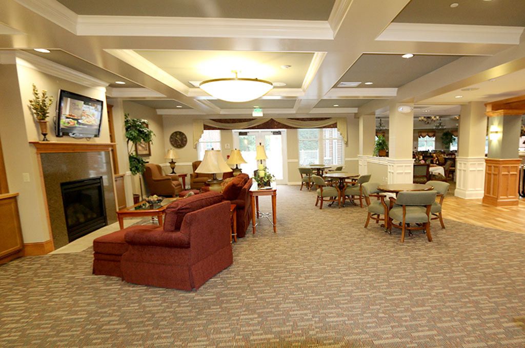 A spacious and elegantly designed lounge area with comfortable seating and cozy lighting.