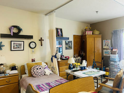 A cozy bedroom setup with personal touches and a warm atmosphere.
