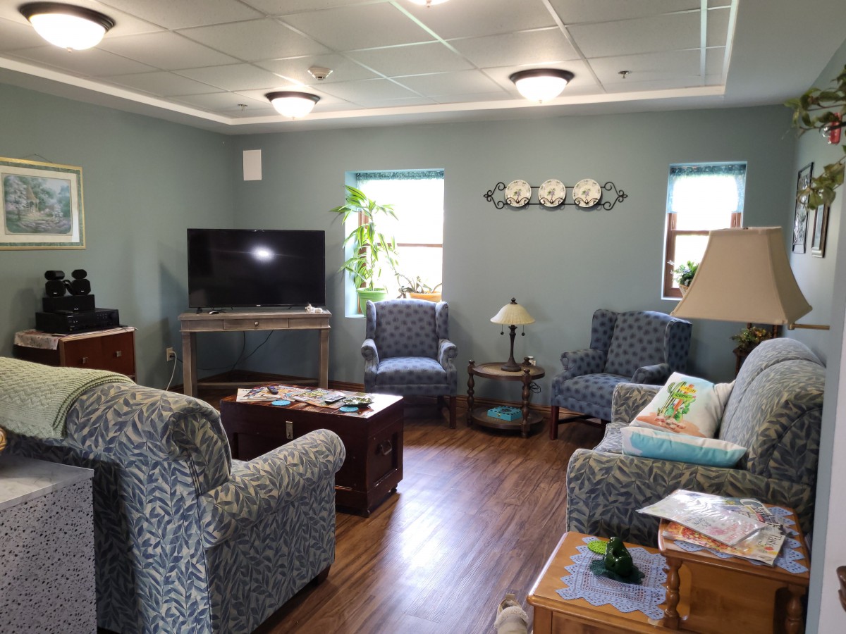A cozy living room with comfortable seating and a television.