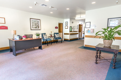 A spacious and welcoming waiting area featuring comfortable seating and a clean, modern design.