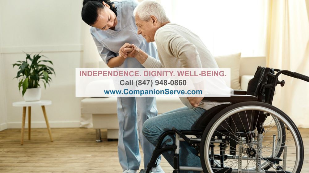 A caregiver assisting an elderly man in a wheelchair, promoting independence, dignity, and well-being.