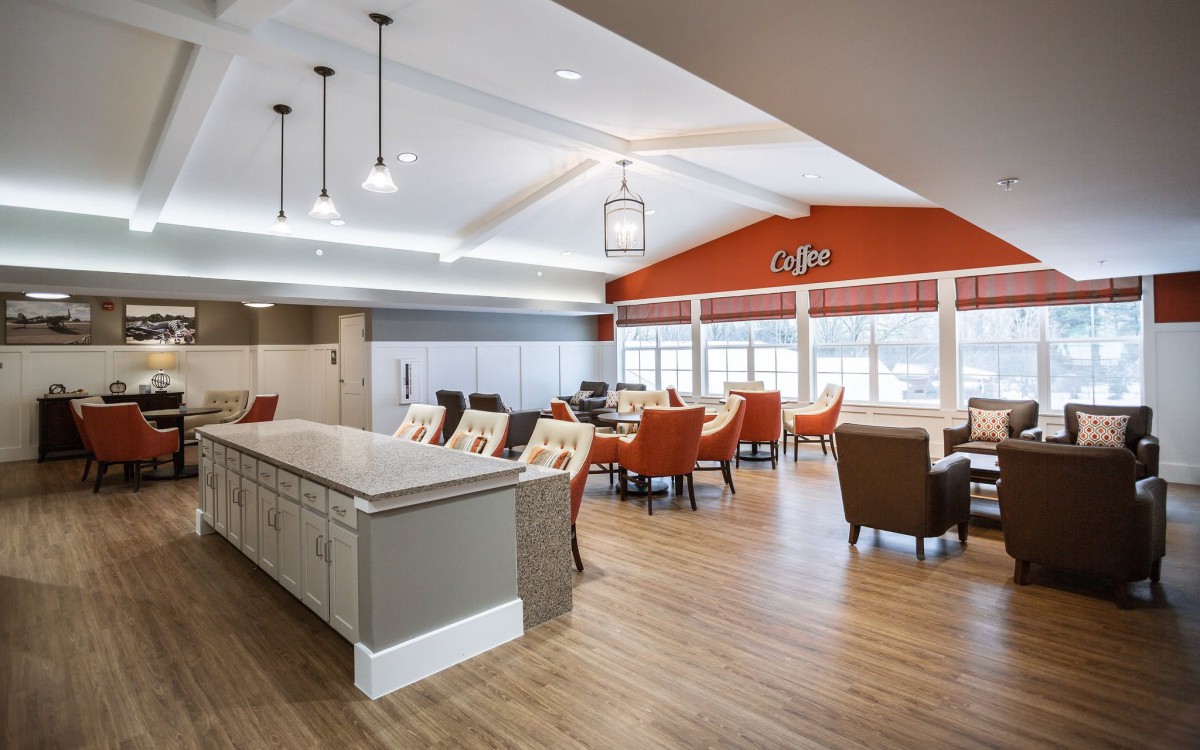 A spacious and modern caf interior with ample seating and bright lighting.