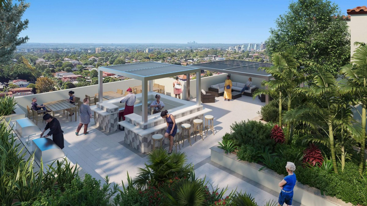 A modern rooftop terrace with a view of the city, featuring seating areas and lush greenery.