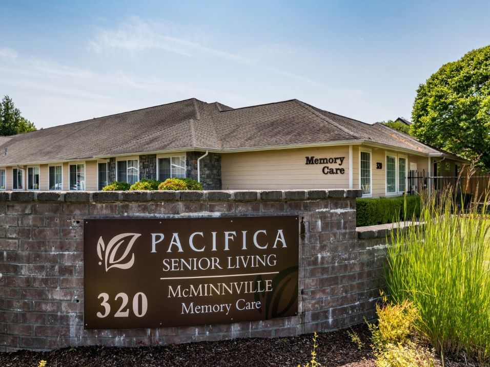 The Pacifica Senior Living McMinnville Memory Care facility with its sign displayed in front.