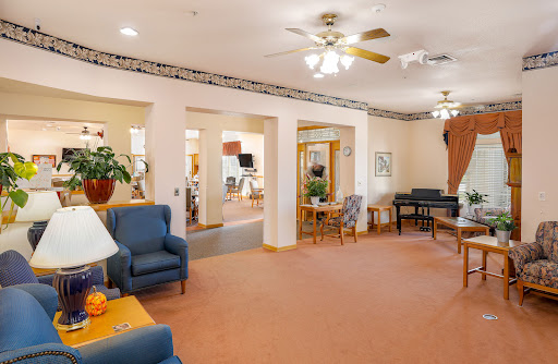 A cozy lounge area featuring comfortable seating and warm decor.
