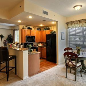A cozy kitchen and dining area with modern appliances and decor.