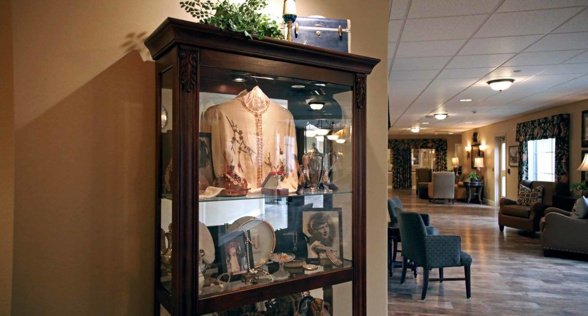 A display case featuring historical memorabilia and artifacts in a museum or exhibit setting.