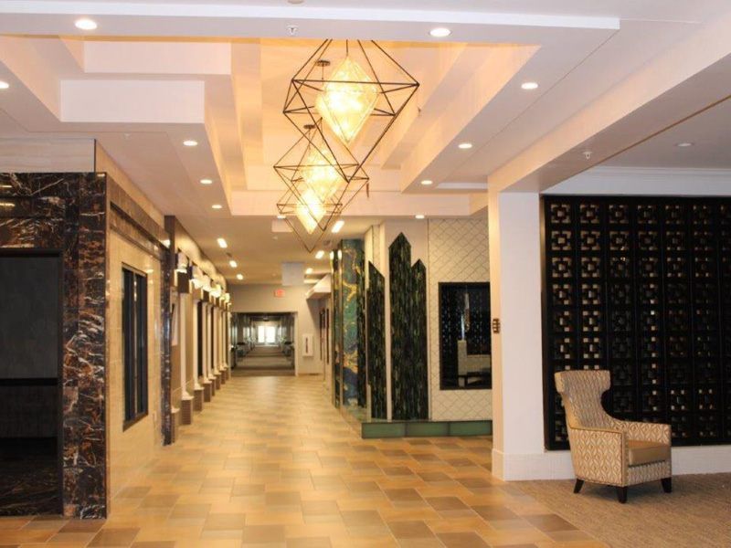 A modern hallway with distinctive lighting fixtures and elegant interior design.