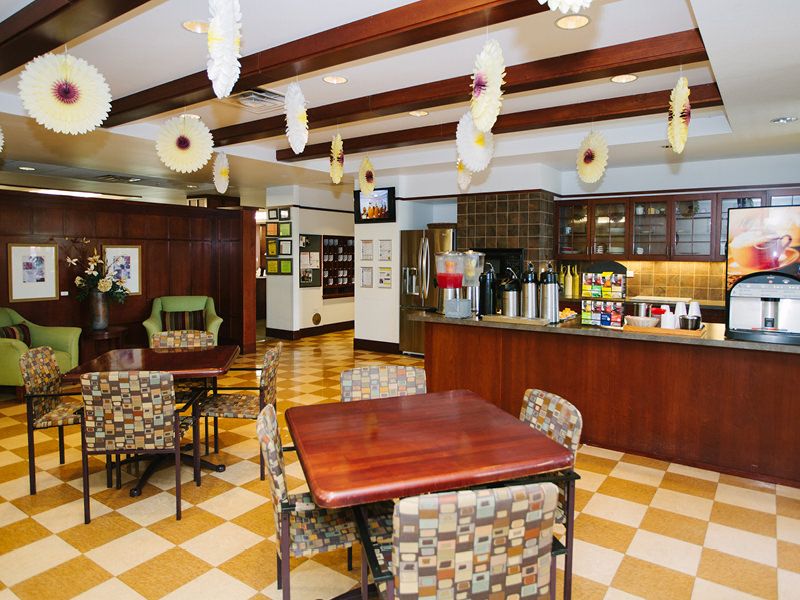 Cozy cafe interior with seating and decor.