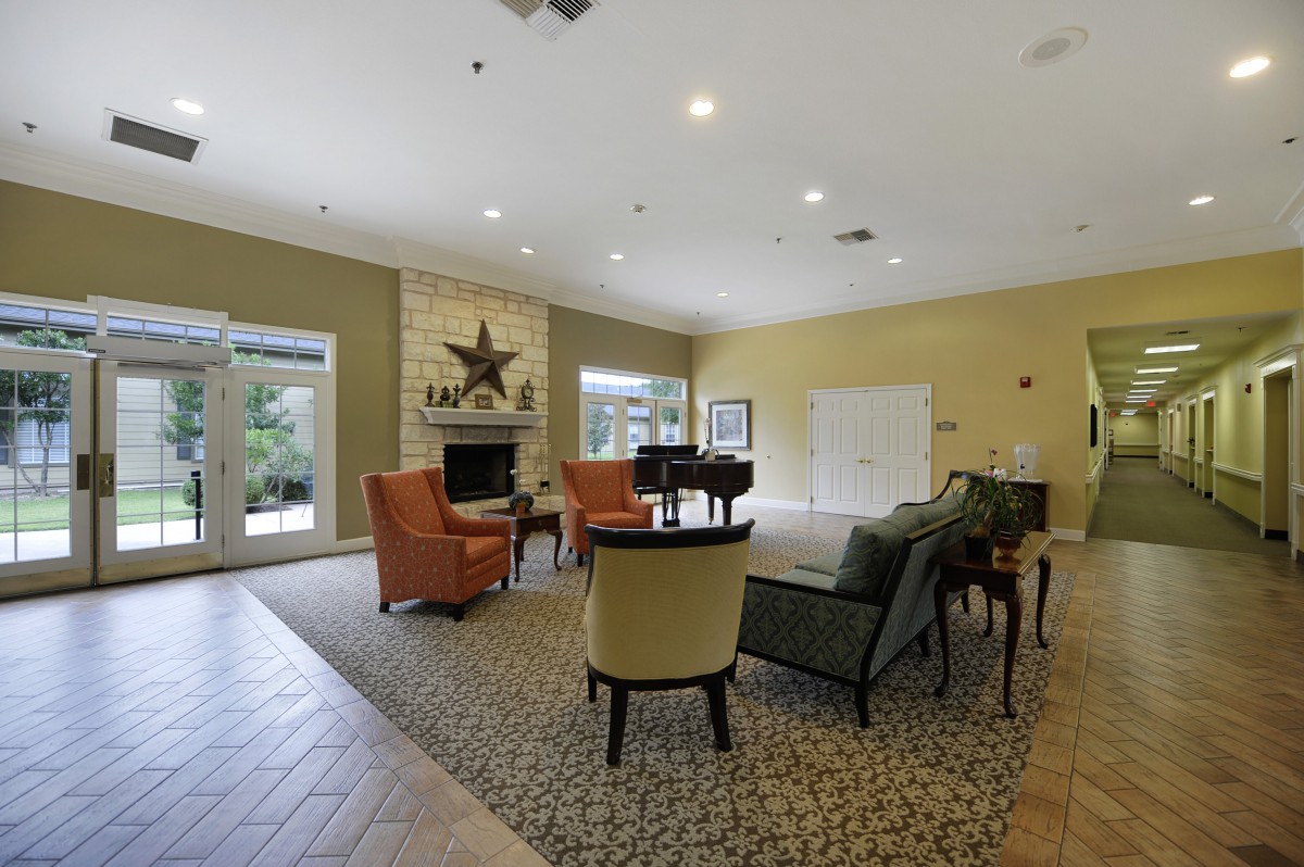 A cozy living room with a seating area and fireplace.