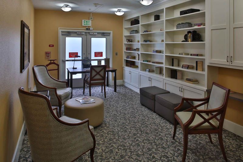 A cozy library with comfortable seating and well-organized bookshelves.
