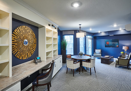 A modern office space featuring stylish furniture and a calming blue color palette.