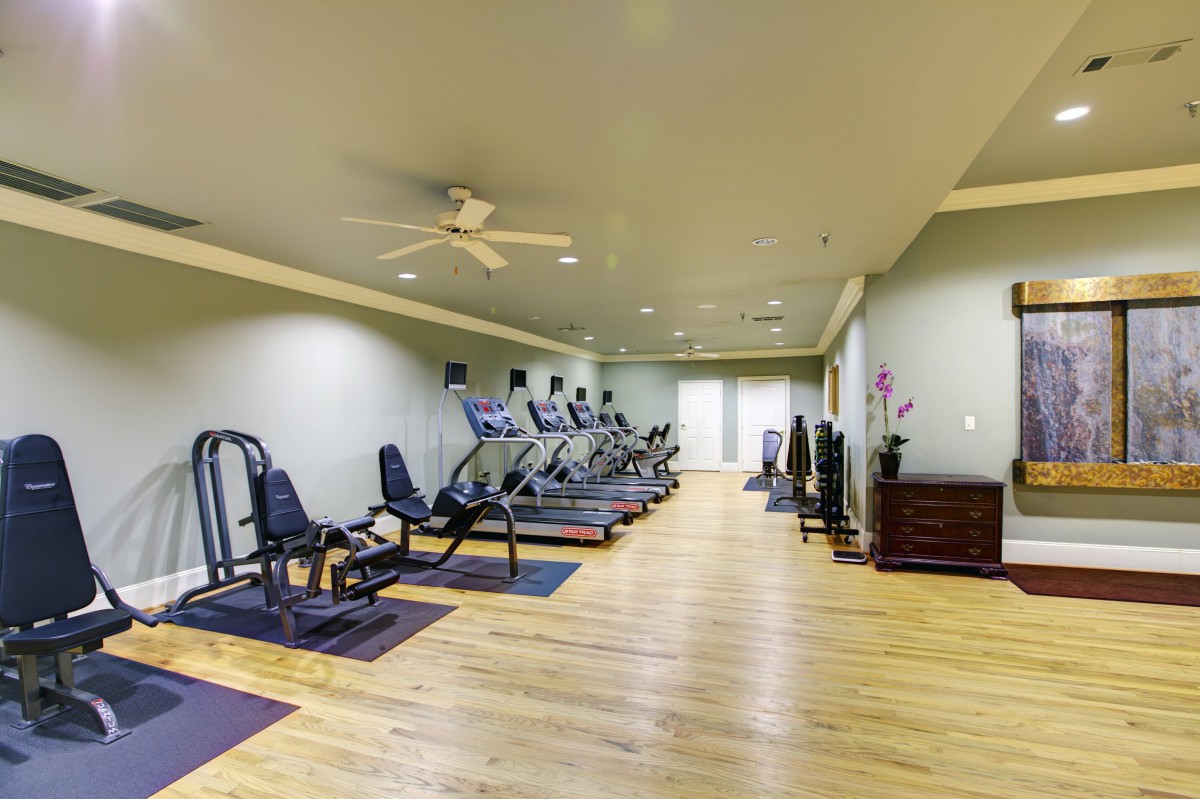 An indoor gym with treadmills and exercise equipment.