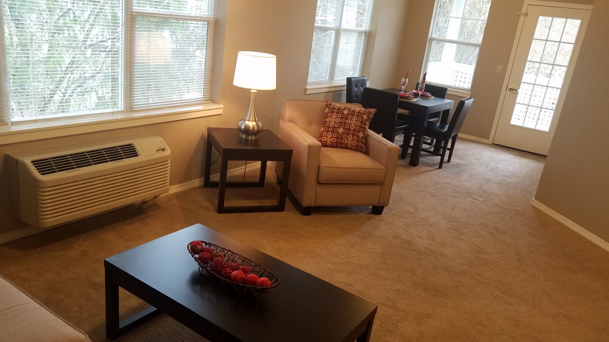 A cozy living room with modern furniture and soft lighting.
