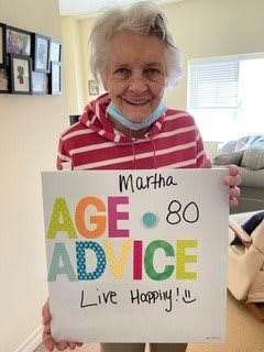 An elderly woman sharing her advice to 'Live Happy' at age 80.