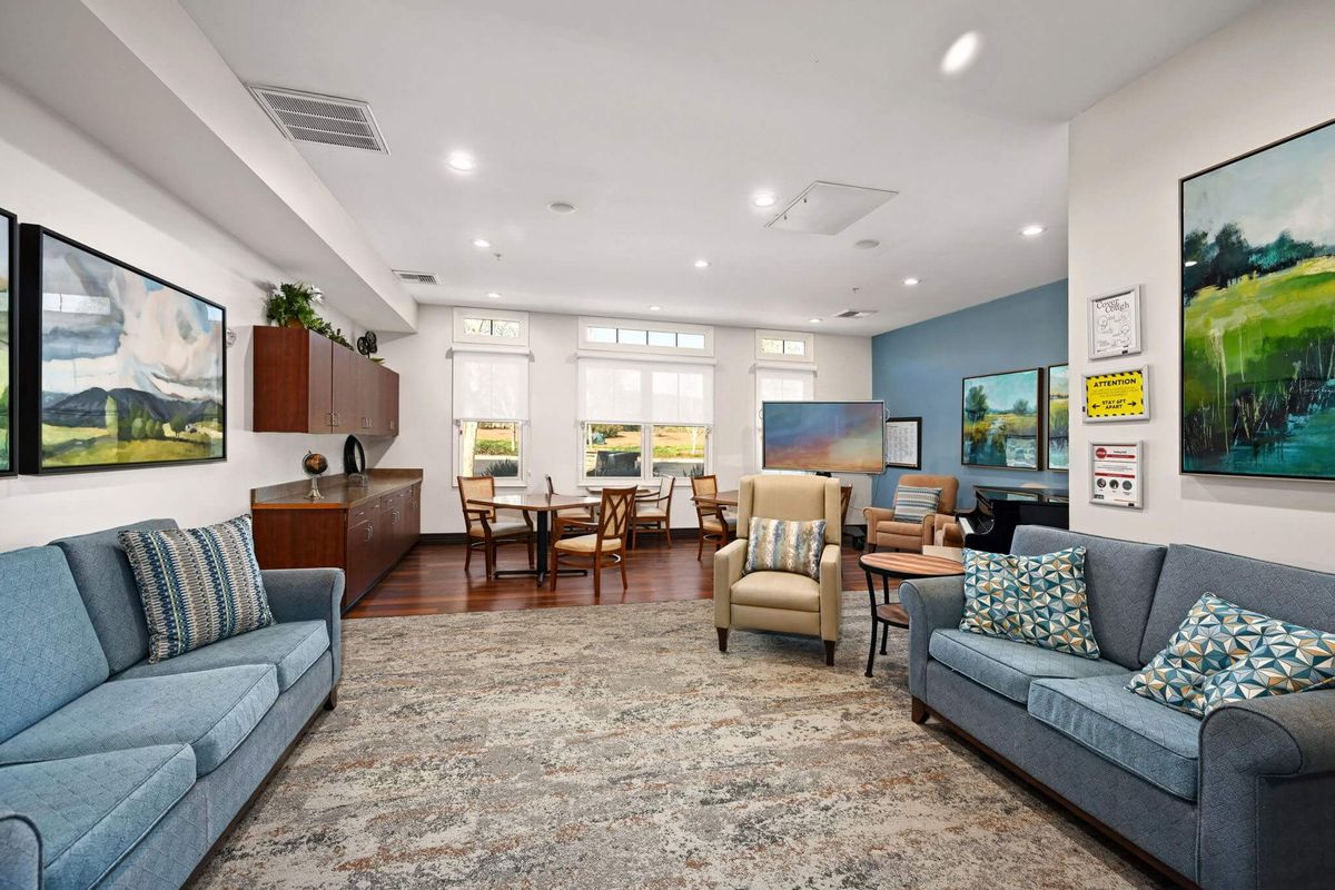 A modern living room with comfortable seating and natural lighting.