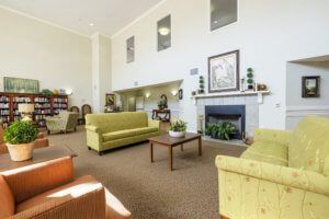 A spacious living room with sofas, a fireplace, and decorative elements.