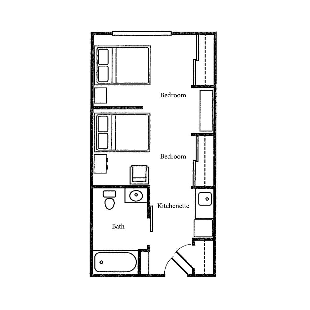 A compact floor plan featuring a bedroom, bathroom, and kitchen.