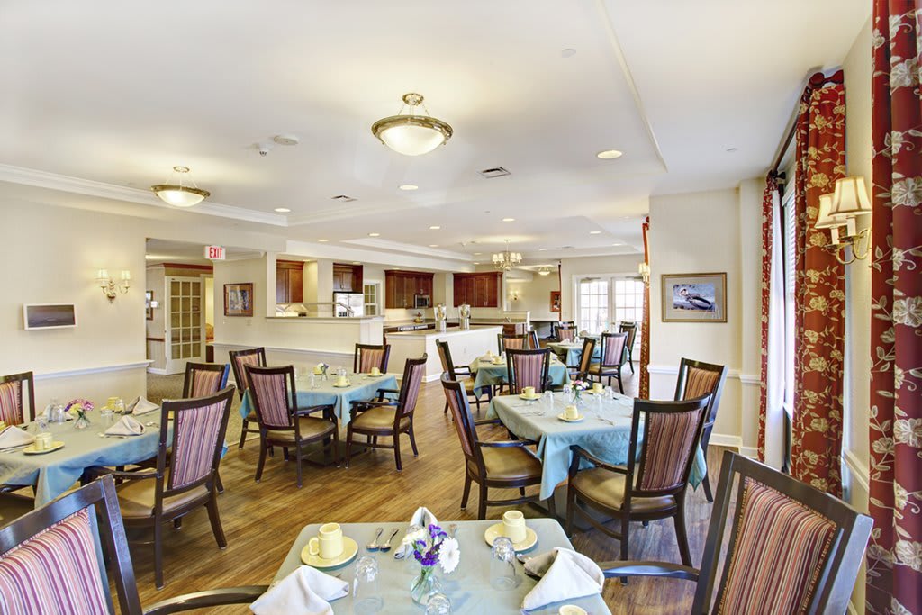 A well-appointed dining area with neatly arranged tables and chairs.