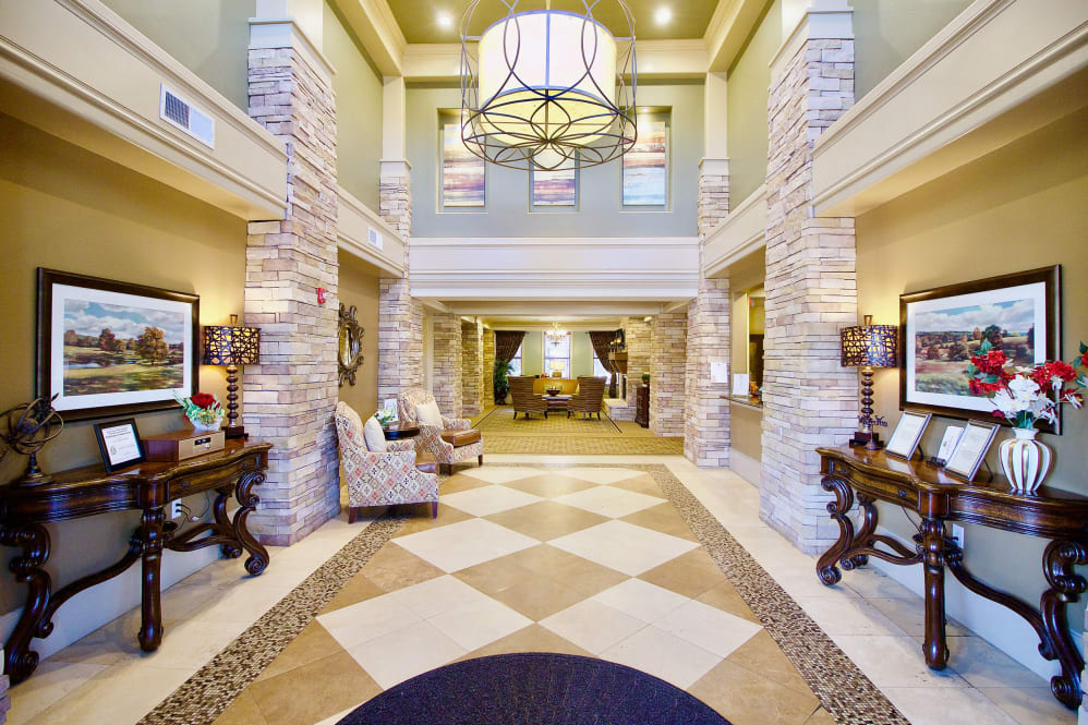 Spacious and elegantly designed lobby with warm lighting and stone accents.