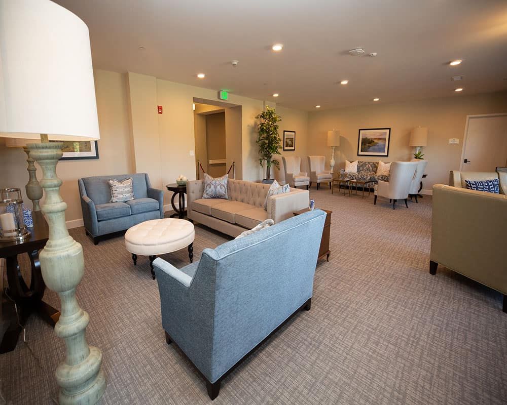 A spacious lounge area featuring comfortable sofas and elegant decor.