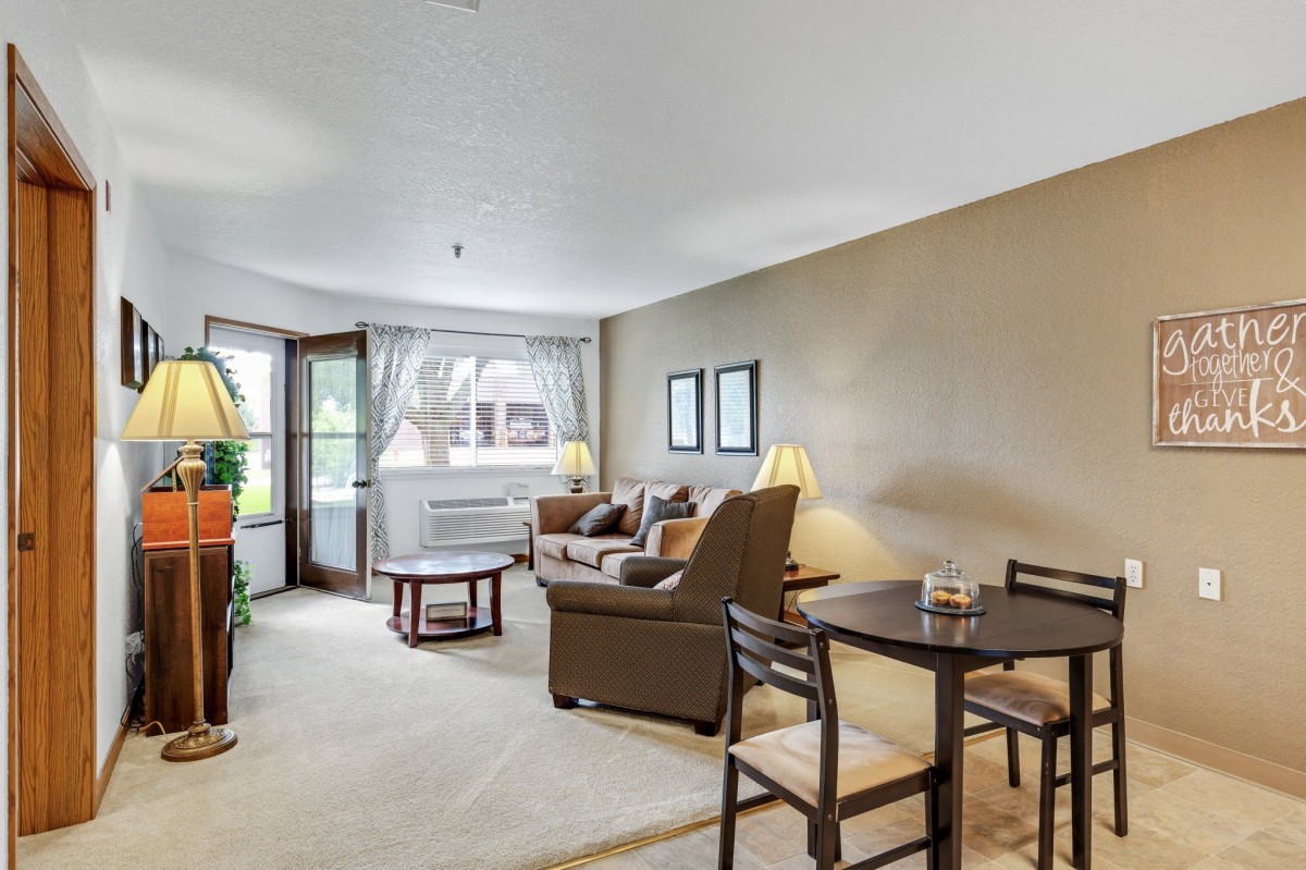 A cozy living room with comfortable seating and natural light.