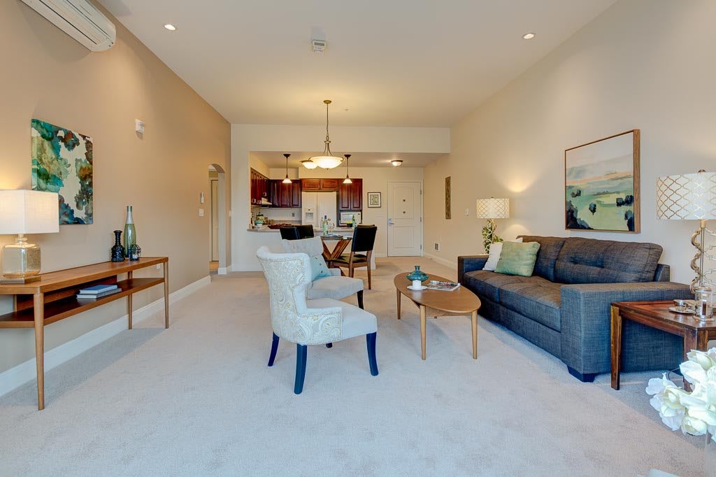 A modern living room with comfortable seating and stylish decor.